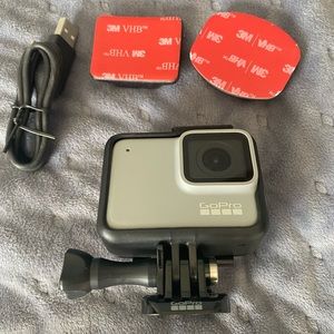 Go Pro with charger and stands